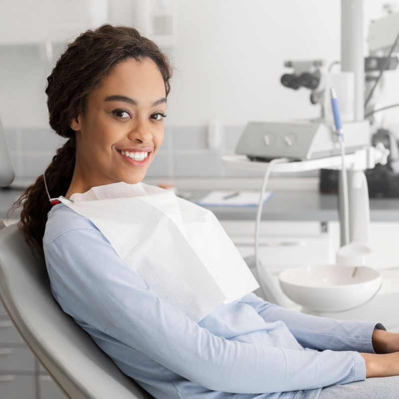 Smiling woman sitting in dental office chair